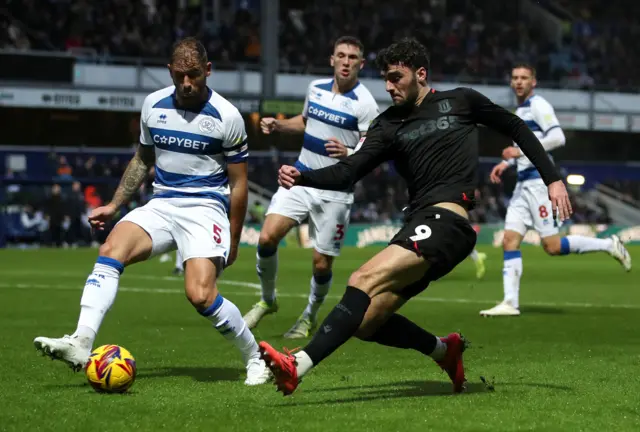 Stoke City's Tom Cannon battles for the ball