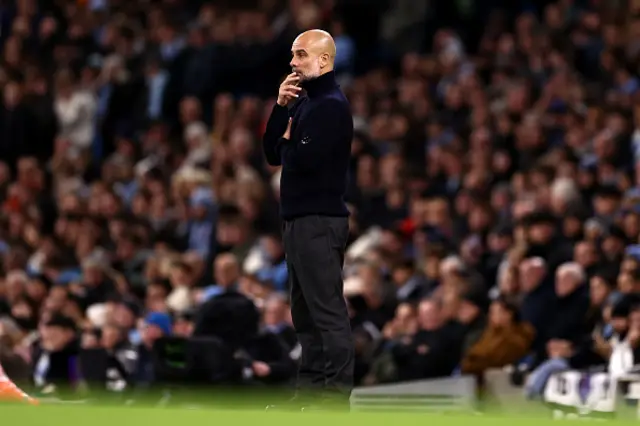 Pep Guardiola, Manager of Manchester City, reacts