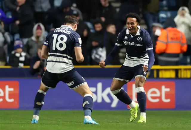 Millwall's Femi Azeez (right) celebrates with teammate Ryan Leonard