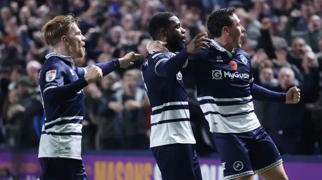 Millwall celebrate a goal against Leeds