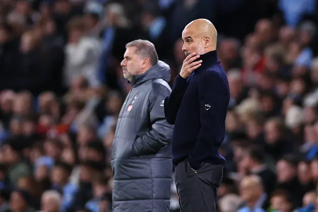 Pep Guardiola manager of Manchester City looks on