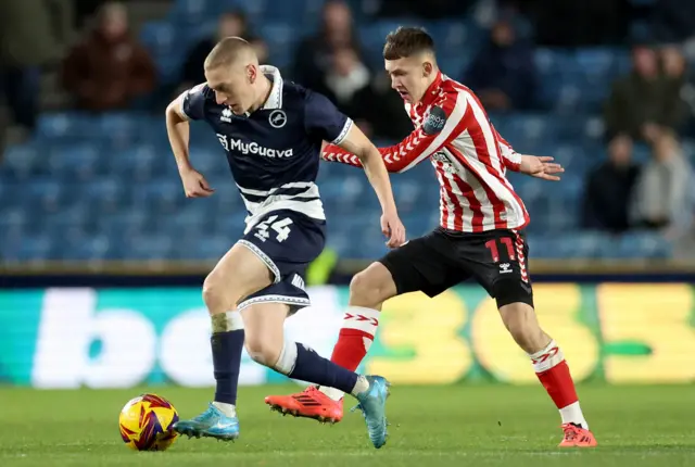 Millwall's Casper de Norre battles for the ball against Sunderland's Chris Rigg