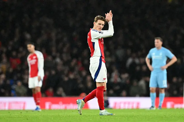 Martin Odegaard of Arsenal applauds the fans