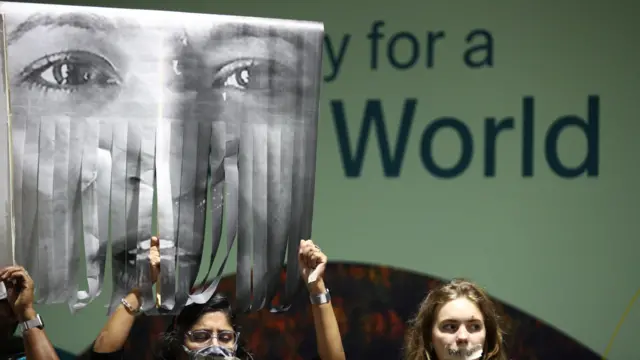 Activists hold a protest during the UN climate conference COP29 in Baku