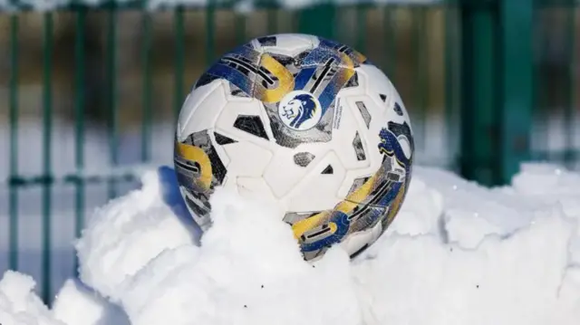 Football covered by snow