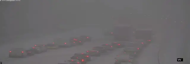 cars stopped in snow on M8