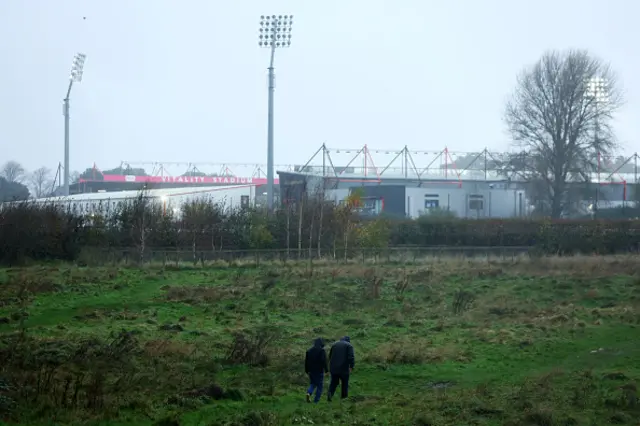 Fans make their way to the stadium