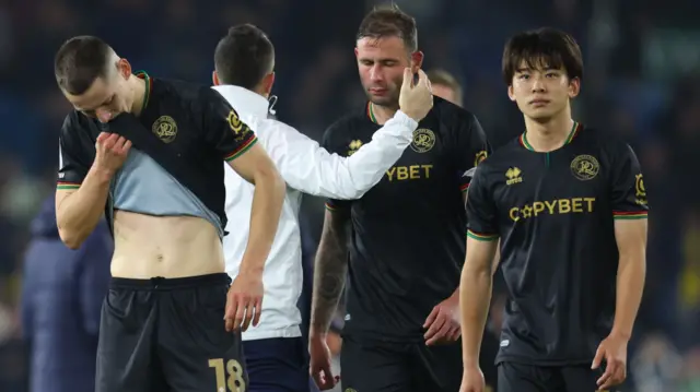 QPR players after their 2-0 defeat at Leeds