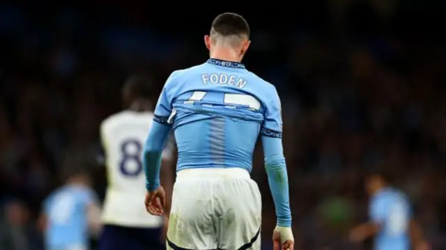 A dejected Phil Foden Pep Guardiola