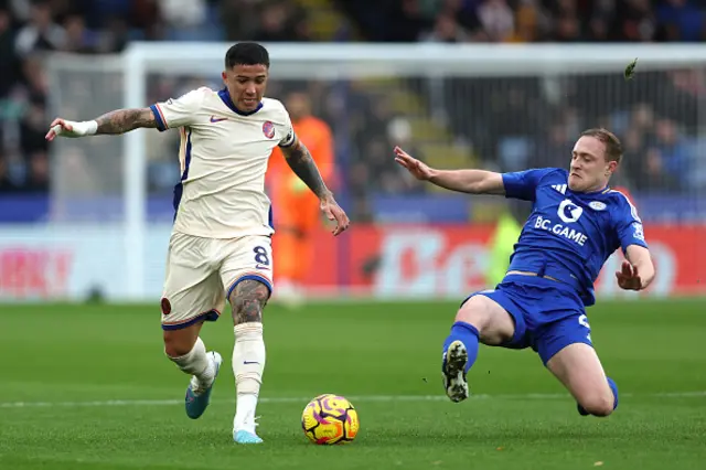 Enzo Fernandez of Chelsea controls the ball under pressure from Oliver Skipp