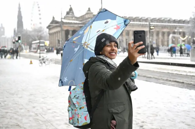 Shopper on soggy Princes Street