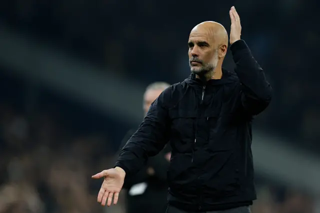 Pep Guardiola, Manager of Manchester City applauds the fans