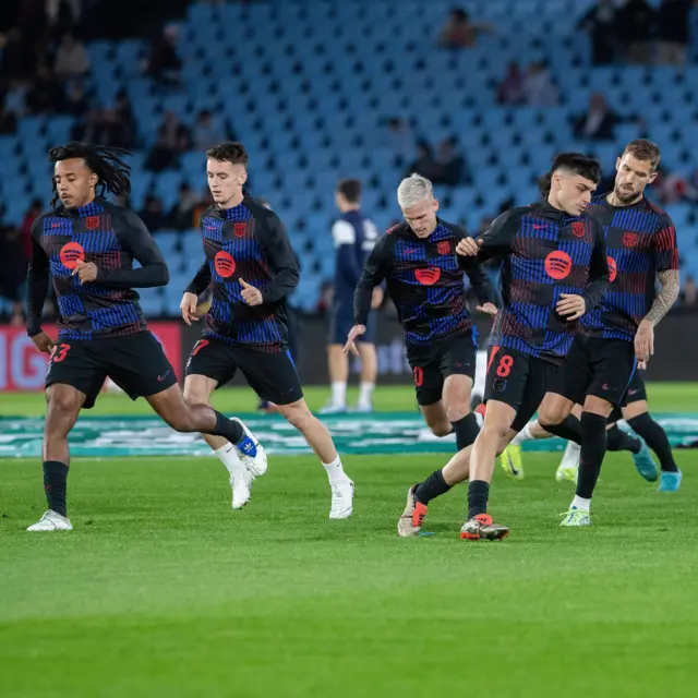 Barcelona players warm up before kick off