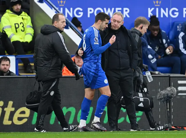 Harry Winks of Leicester City interacts with Steve Cooper