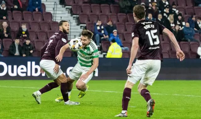 EDINBURGH, SCOTLAND - NOVEMBER 23: Celtic's James Forrest (R) is brought down in the box by Hearts' Jorge Grant during a William Hill Premiership match between Heart of Midlothian and Celtic at Tynecastle Park on November 23, 2024, in Edinburgh, Scotland. (Photo by Paul Devlin / SNS Group)