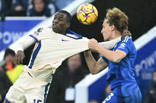 Nicolas Jackson (L) vies with Leicester City's Belgian defender #03 Wout Faes