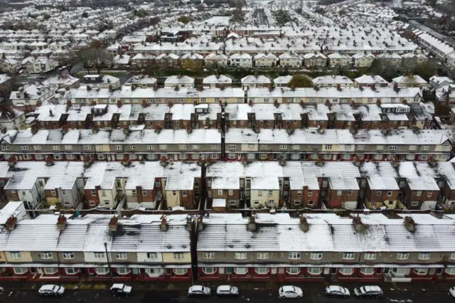 Aerial shot of rows of houses in Liverpool with snow-topped roofs