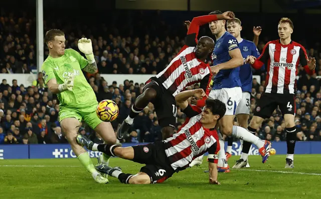 Brentford's Yoane Wissa in action as Brentford's Christian Norgaard fouls Everton's Jordan Pickford