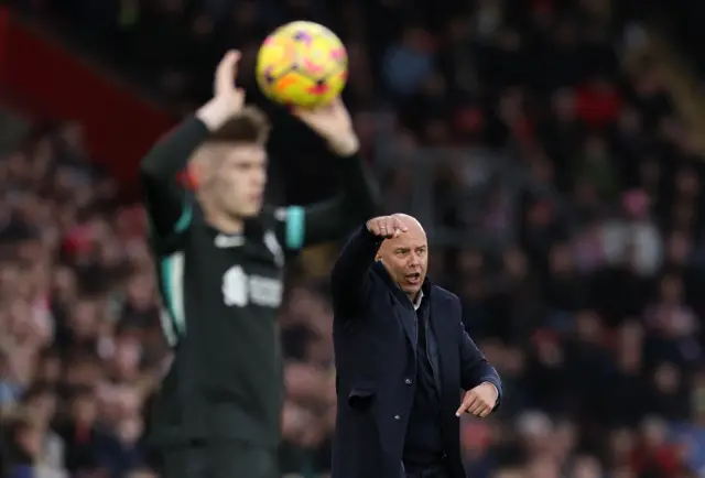 Slot directs his team from the touchline