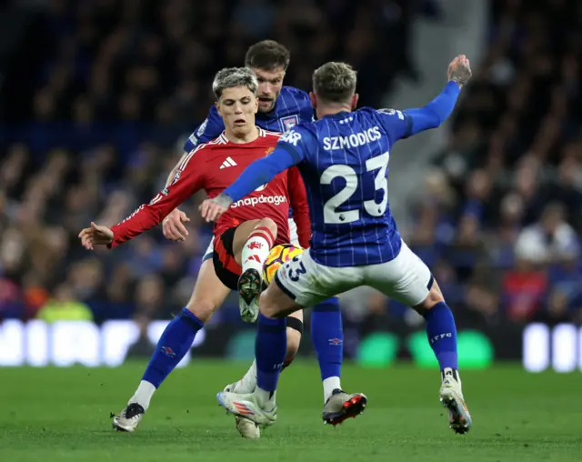 Garancho tries to win the ball in between two defenders