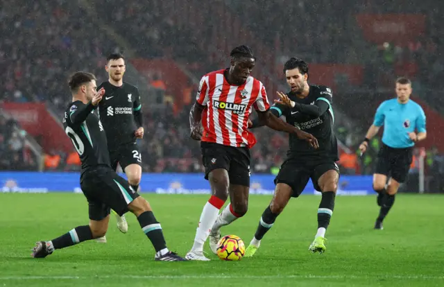 Liverpool players surround Ugochukwu