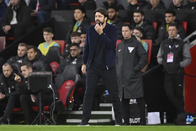 Martin scratches his chin in the technical area