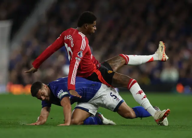 Rashford is upended by Morsy in midfield