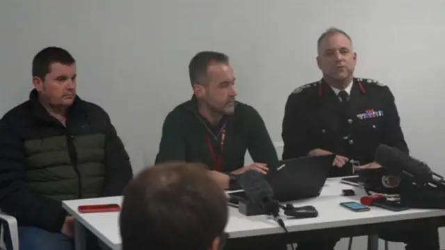 Councillor Morgan (L); Christian Hanagan (C), the director of communication for the council; Fire Chief Fin Monahan (R) in uniform