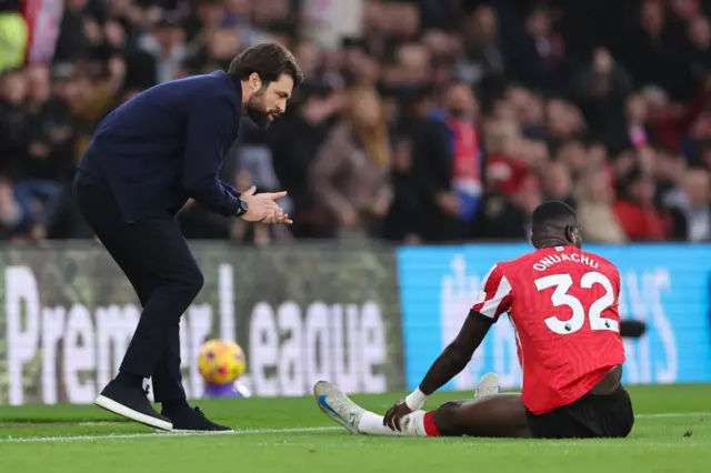 Martin encourages Onuachu after he is hauled to the floor by a defender