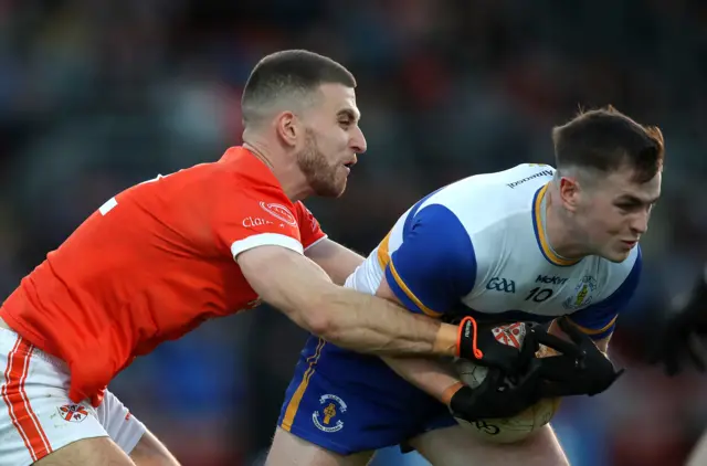 Clann Eireann's Shea Heffron tackles Ruairi Canavan of Errigal Ciaran