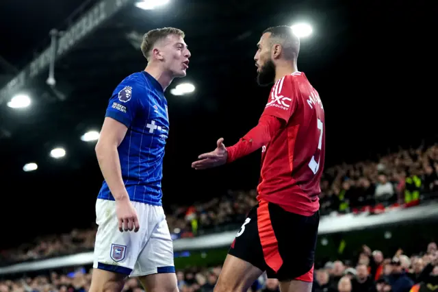 Delap and Mazraoui face off after a coming together