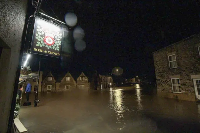 Flooded street around Rose &Crown pub in Malmesbury, north Wiltshire