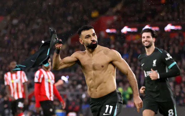 Mohammed Salah celebrates by taking his shirt off after scoring a penalty against Southampton