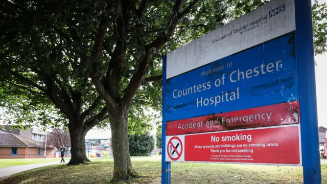 A sign for the Countess of Chester Hospital. It is blue and signals for the Accident and Emergency department