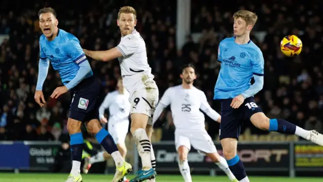 Port Vale striker Jayden Stockley heads towards goal