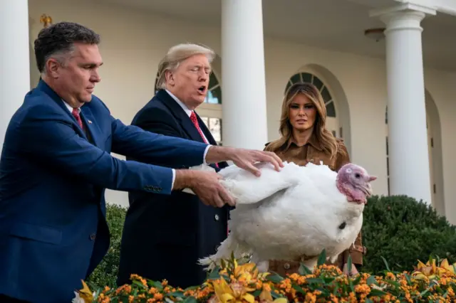 U.S. President Donald Trump gives a presidential pardon to the National Thanksgiving Turkey