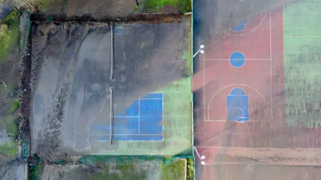 An aerial view of sports courts in Ynysangharad Park which flooded after the River Taff breached its banks, on November 25, 2024 in Pontypridd, Wales. On Sunday 24th the River Taff breached its banks leaving residential and commercial premises flooded