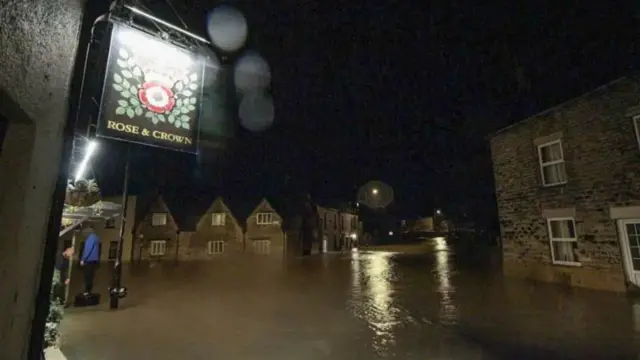 Flooded scene outside of pub in Malmesbury