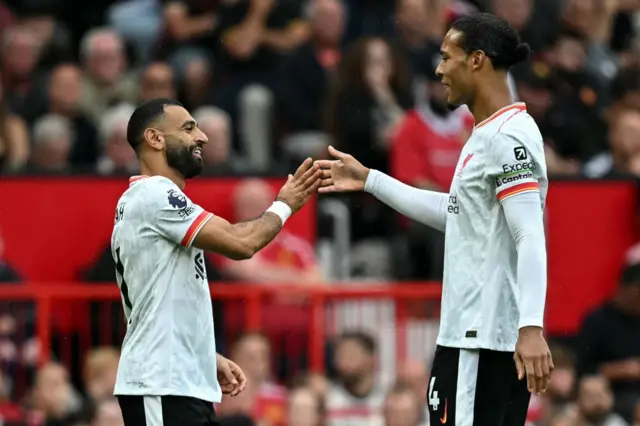 Mohamed Salah embraces Virgil van Dijk at Old Trafford