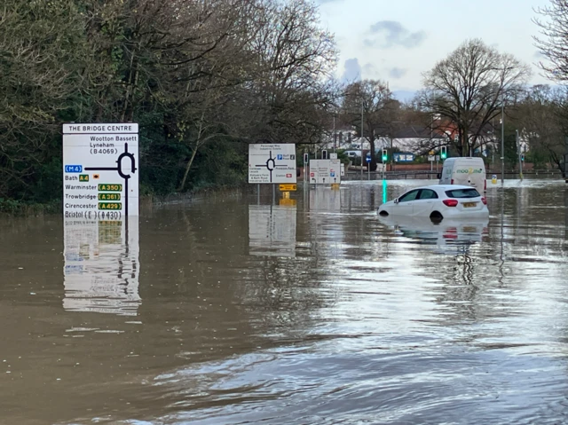 Cars are abandoned as water is high in Chippenham by the bridge centre roundabout