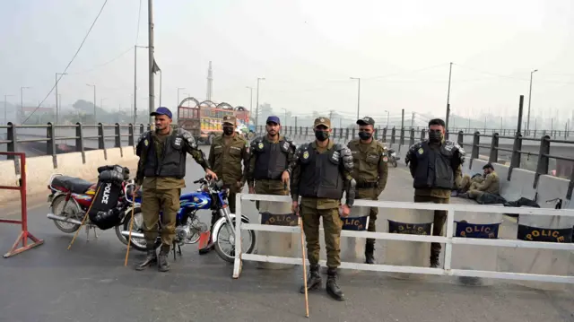 Police stand guard as authorities close highways and motorways during a protest by the opposition Pakistan Tehreek-e-Insaf (PTI) party of jailed former Prime Minister Imran Khan in Lahore, Pakistan, 24 November 2024.