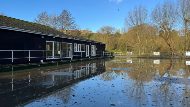 The ground around Malmesbury Bowls Club submerged under water.