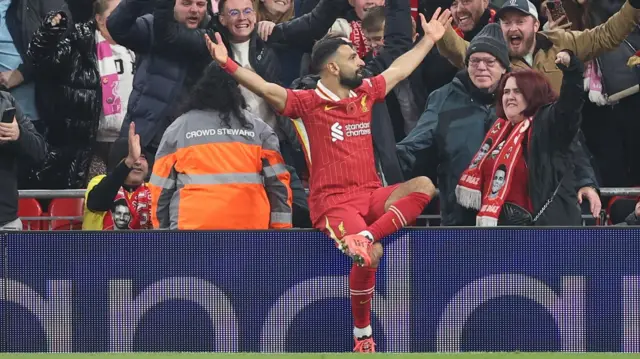 Mohamed Salah celebrates with Liverpool fans after scoring