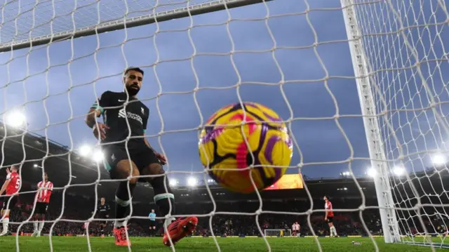 Mohamed Salah goes to pick the ball out of the net after scoring for Liverpool at Southampton