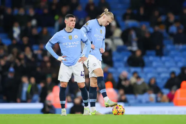 Phil Foden and Erling Haaland look dejected following Manchester City's defeat to Tottenham