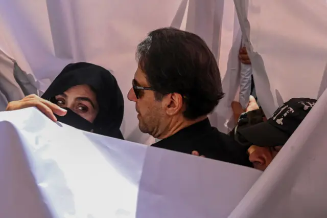 Former Pakistan Prime Minister Imran Khan with his wife Bushra Bibi