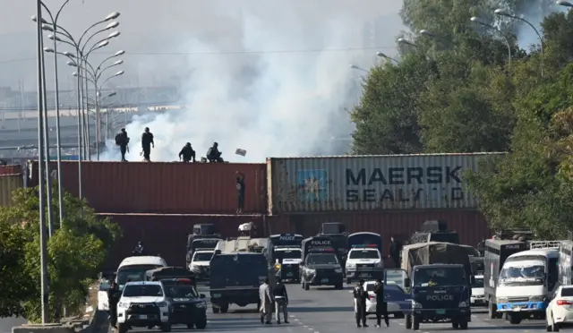 Pakistani security forces fire teargas shells against PTI supporters