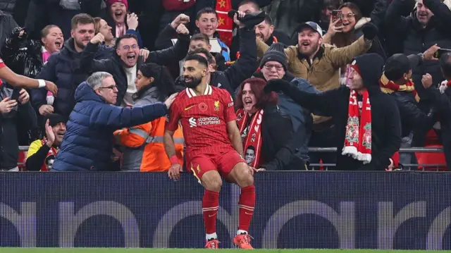 Mohamed Salah celebrates with Liverpool fans