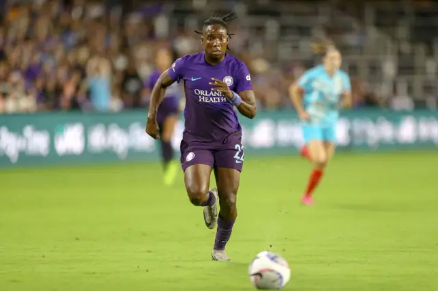 Barbra Band runs towards the ball while playing for Orlando Pride