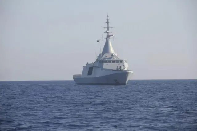 A large military boat in the sea